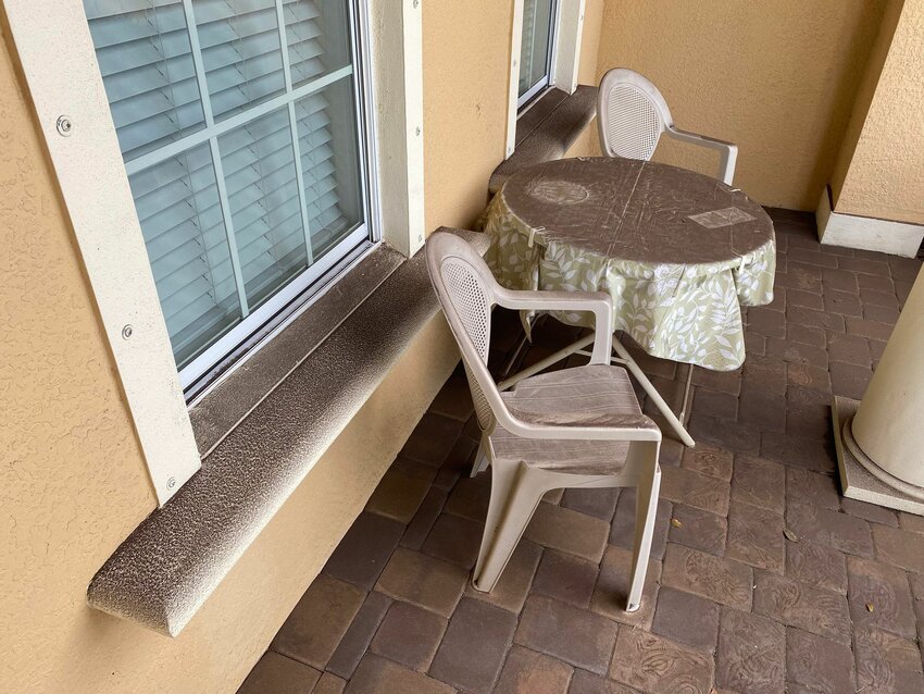 A porch is covered in dust from a large-scale development site in Bradenton. Photo by: Bo Mortensen