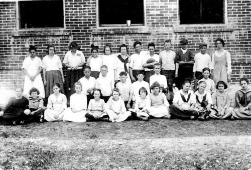 Sixth, seventh and eighth grade students in front of the schoolhouse on Terra Ceia Island circa 1919-1920.