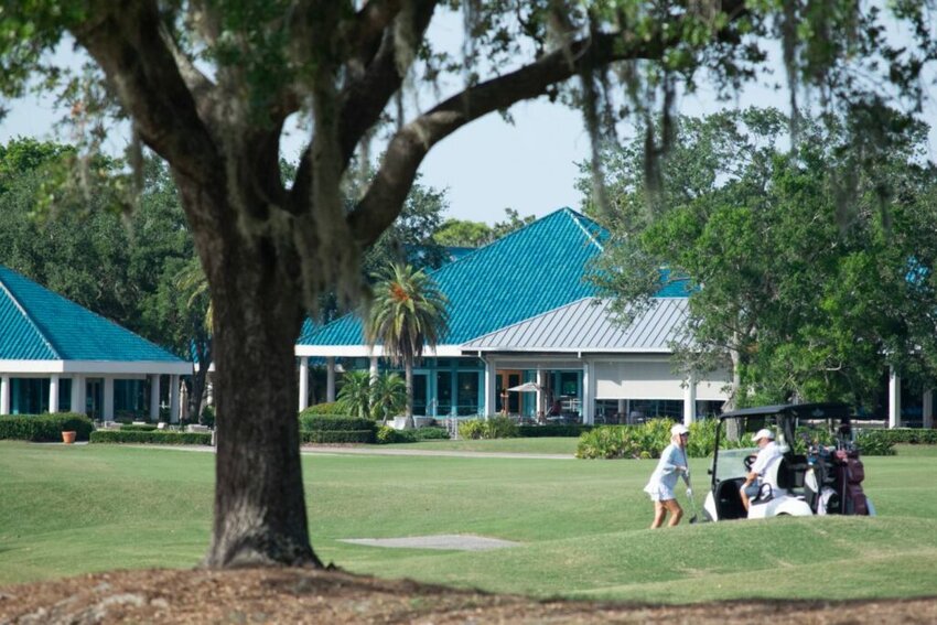 Golfers play at University Park Country Club Golf course, which features 27 holes on acres of European-style putting greens and sand bunkers. | Photo by C. Todd Sherman, Suncoast Searchlight