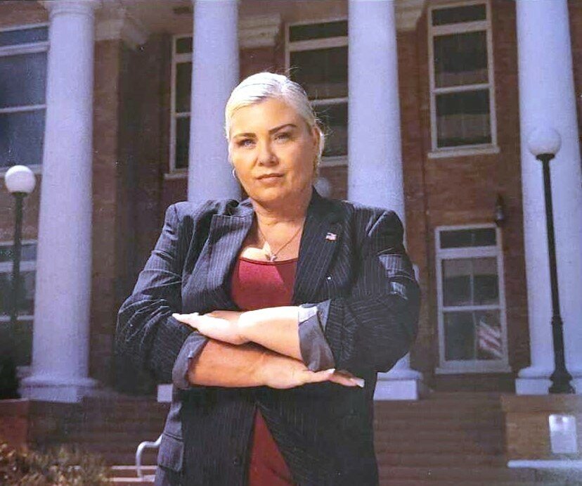 Manatee County District 3 Republican Candidate April Culbreath poses for a photo outside the county's historic courthouse.