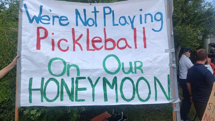 Sign displayed at a protest at Honeymoon Island State Park on Aug. 27, 2024. (Photo by Mitch Perry/Florida Phoenix)