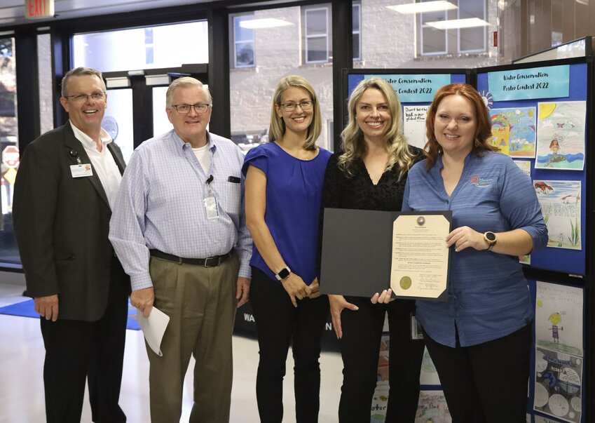 Manatee County Utilities Deputy Directors Katie Gilmore and Kevin Morris pose for a photo with colleagues after accepting a proclamation recognizing Water Conservation Month on April 12, 2022. 
(Left/Right: Bruno Kapacinskas, Kevin Morris, Katie Gilmore, Olga Wolanin, Tina Moutoux)