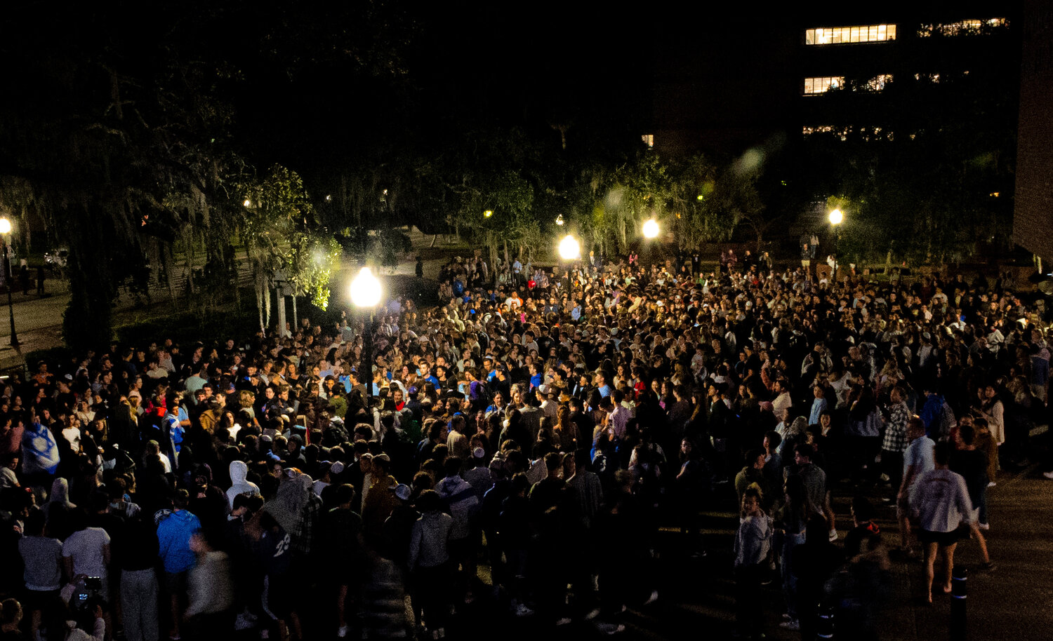 University of Florida students hold a vigil supporting Israel in Turlington Plaza before a scare caused the crowd to run for cover Oct. 9, 2023.