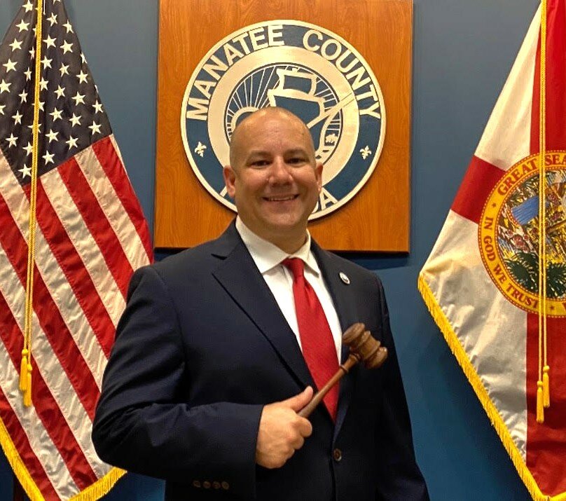 Manatee County District 3 Commissioner Kevin Van Ostenbridges poses for a photo with the chairman's gavel.