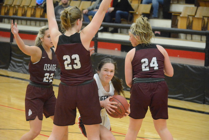 Buffalo&rsquo;s Bella Young found herself surrounded by three Osage defenders Friday night, but the senior managed to pass the ball away to a teammate. Young finished the game with a team-high 17 points &mdash; 15 of them in the second half &mdash; in Buffalo&rsquo;s 44-39 win over the Lady Indians. The high school basketball season is well into its second month, and the Lady Bison will host Conway on Thursday night. Both Buffalo boys and girls teams will play in the Stockton Tournament next week.