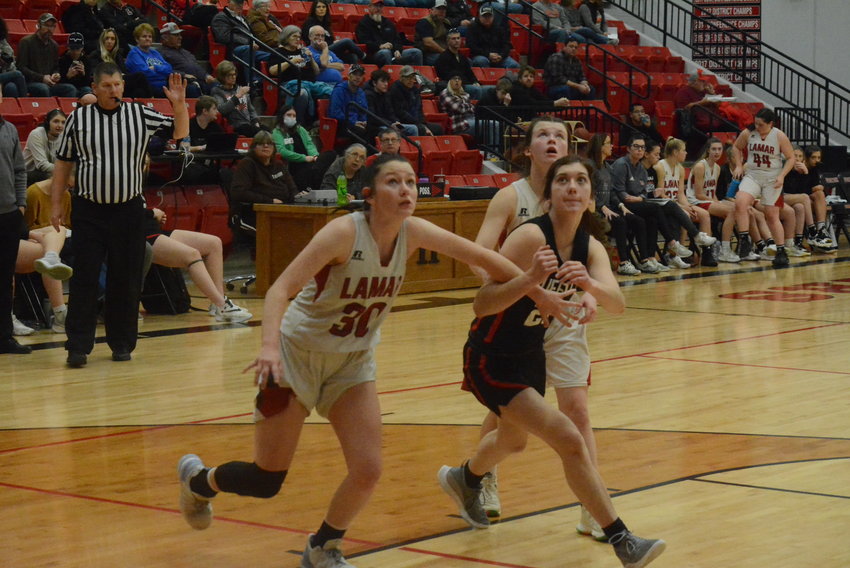 Audrey Peterson fights for a rebound against Lamar.