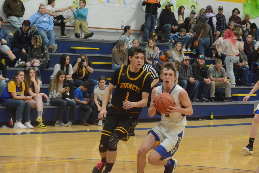 Logan Gallamore drives to the basket against Fair Play. He scored 17 points and had eight assists and nine steals in the game.