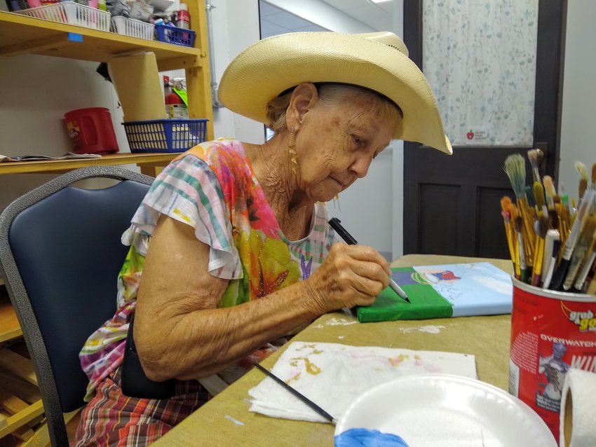 Every Tuesday afternoon after lunch, Phyllis Logan helps other budding artists create works of art at the Montgomery Senior Center in Buffalo. All seniors are welcome to join the painting party each week. Paint and canvas are provided.