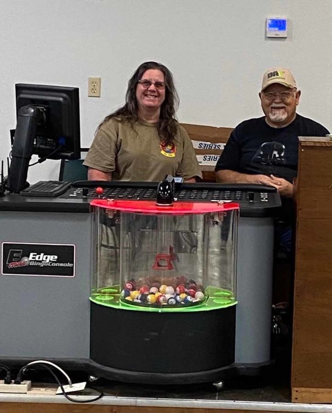 Peggy Roberts, left, bingo chairman, and Ken Wickham, DAV Chapter 62 commander, call bingo numbers as they get them from the new equipment.