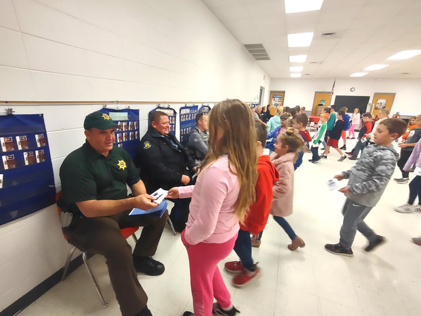 Skyline hosted a law enforcement appreciation breakfast the morning of Thursday, Oct. 20, in the Skyline Elementary School cafeteria. After breakfast, all the elementary classes came in to present the law enforcement officials with thank-you cards. Dallas County Sheriff Scott Rice, left, was among the participants.