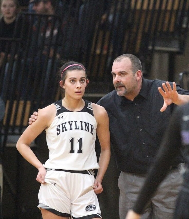 Skyline coach Kevin Cheek gives some instructions to his daughter, Kenzi, in a recent game. Kenzi is the point guard for the Lady Tigers.   Reflex photo by Kelli Cheek