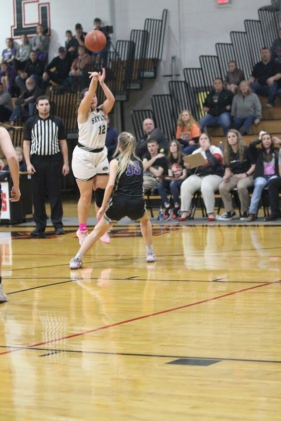 Emily Edwards gets off this successful 3-point shot that won the game for Skyline against Fair Grove.   Reflex photo by Kelli Cheek