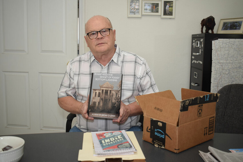 Local author Gerald Ulmer poses proudly with a printed copy of his new first novel, &ldquo;Jenny and the Ghosts of Foggy Bottom Landing.&rdquo;   Photo by Steve Johnson