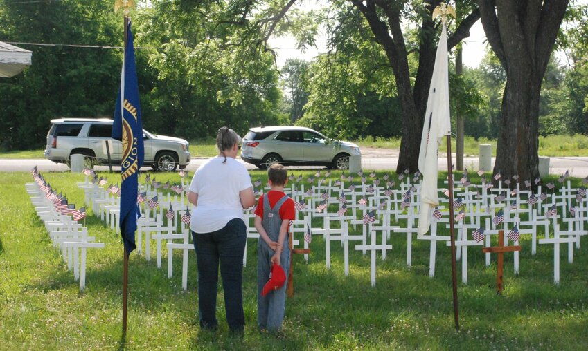 People of all ages paid their respects to fallen soldiers during the annual Memorial Day Service at Cross Timbers.   Reflex photos by Andrew C. Jenkins