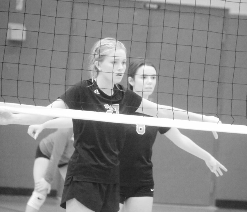 Kayli Smith (27) and Elizabeth Western aren&rsquo;t very big, but they have been consistently good at the net for the Lady Bison this year.