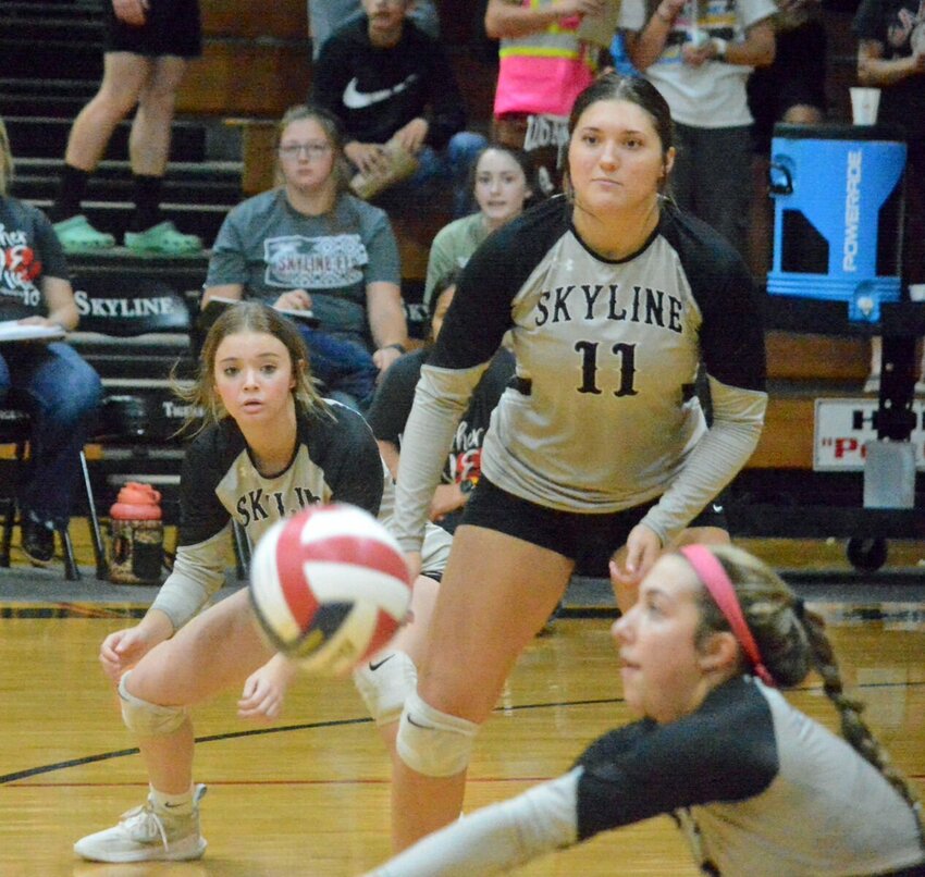 Autumn Baldwin, bottom, gets a &ldquo;dig&rdquo; as Chayla Tuning (11) and Brooklyn Miller are poised to help out.