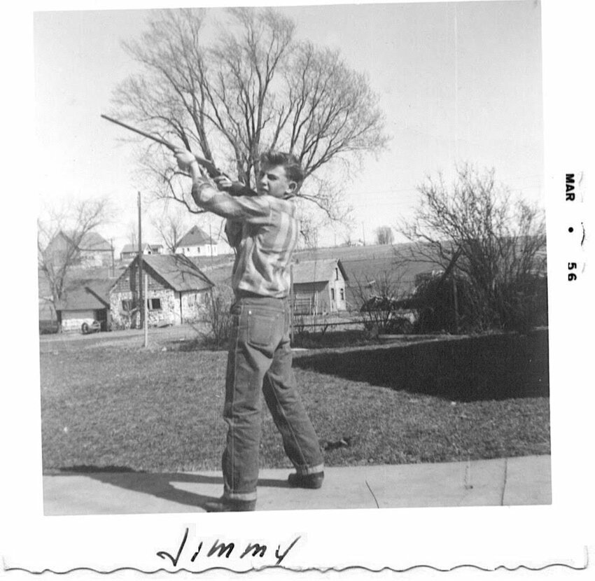 Jimmy Thomas showing off his gun.