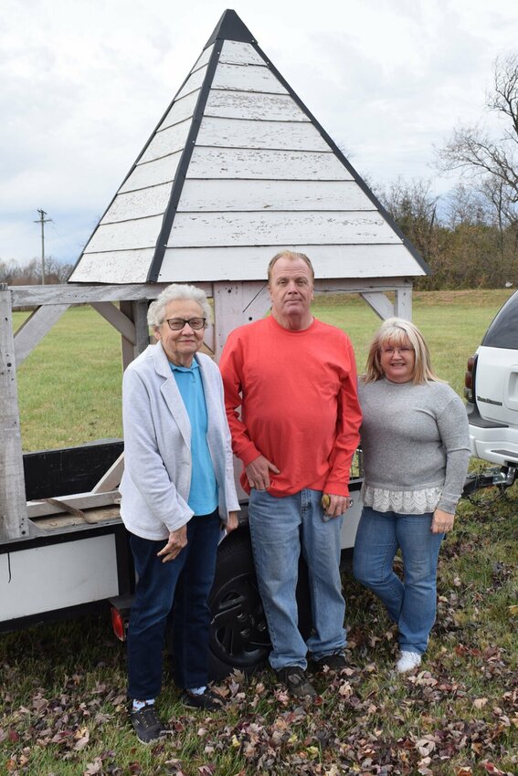 Tom Campbell, center, built and delivered this belfry for the Windyville School Bell. Pictured with him are Dallas County Historical Society members Marcia Shepard and Jeannie Cook.