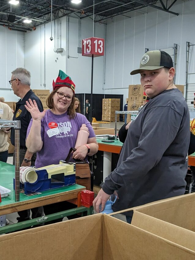 Mother and son worked the line together. Students, starting at 13, may volunteer with a chaperone. Buffalo Middle School Teacher, Jana Simpson and Fair Grove High School student, Samuel Simpson goof around when the camera came out.
