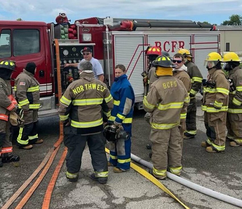 Buffalo City Fire &amp;amp; Rescue Chief Greg Cunningham demonstrates basic hose procedures to a group of novice firefighters.