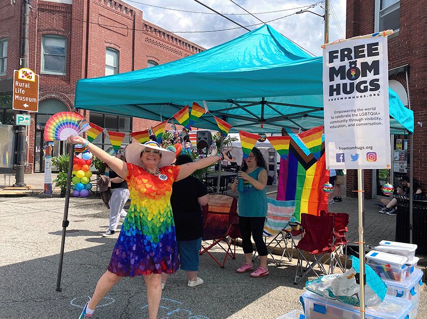 Deanna Zakes welcomes everyone to the Free Mom Hugs booth during the Caroline Pride Festival. Zakes is the regional director for Free Mom Hugs. For more information, see freemomhugs.org.
