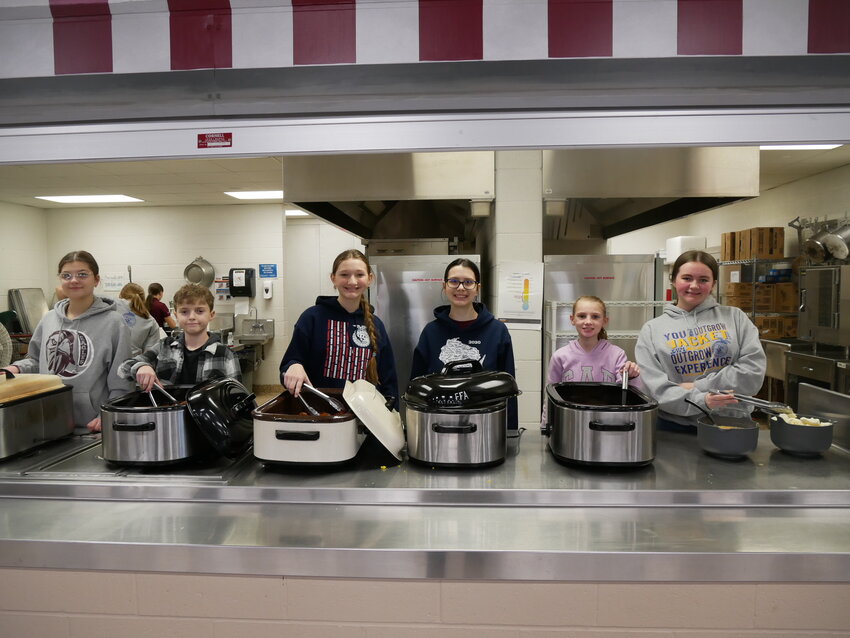 The FFA team serves their annual Pancake Breakfast in the high school cafeteria to kick off FFA week.