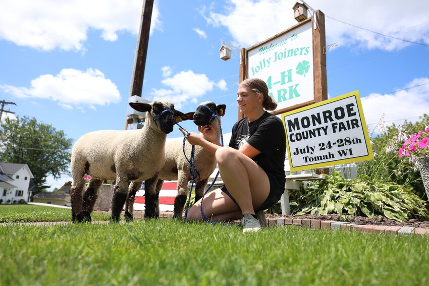 Robin and Roo put their best faces forward while handler Aubri Schaldach tries to persuade them to look up. Schaldach will be bringing these two market sheep into the show ring at the Monroe County Fair on Thursday, July 25.