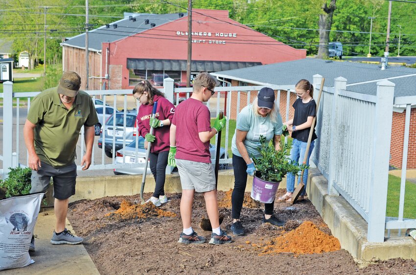 Preparing the ground for shrubbery are the planting platoon Eric Miller, Gabbi Cook, Conner Cook, Dena Azevedo and Chara Dalton