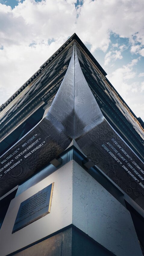 The memorial, designed by architects Richard Joon Yoo and Uri Wegman, will consist of a stainless steel ribbon with a textured fabric pattern descending from the ninth floor along the building’s corner.