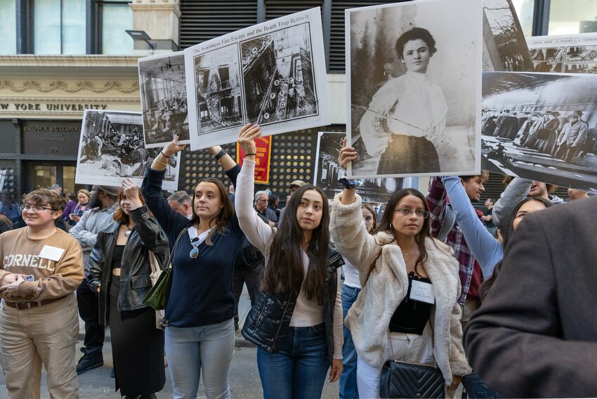 Students displayed photos of New York garment workers during Wednesday’s dedication of the memorial. Courtesy NYS Department of Labor