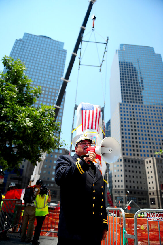 Monsignor John Delendick during a July 2011 tribute ceremony at the 9/11 Memorial Museum. Photo: FDNY