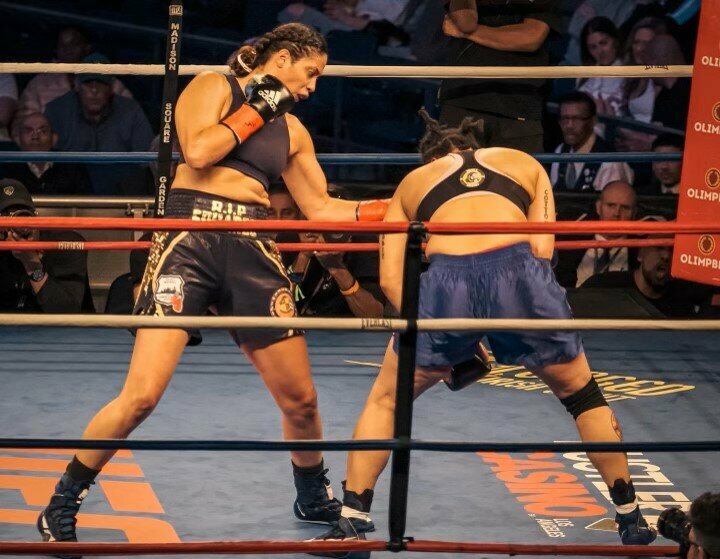 Nisa Rodriguez, an NYPD officer, landing an uppercut. Rodriguez, a Bronx native, won her pro boxing debut March 15. Photo: Spencer Tucker, NYPD