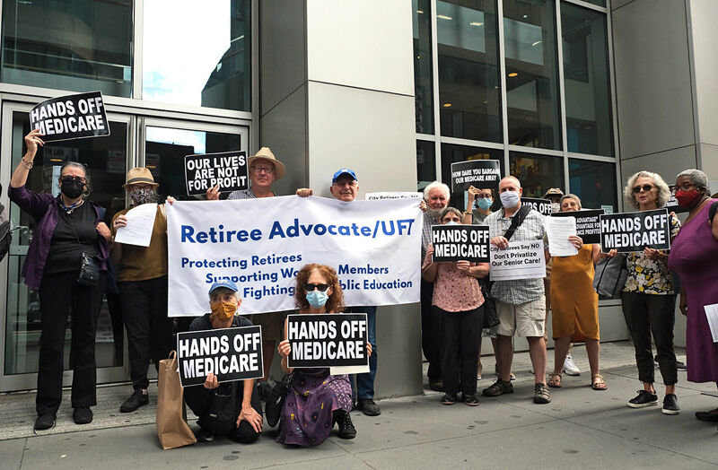 HEARING IT FROM ALL SIDES: A small contingent of retirees gathered outside United Federation of Teachers headquarters to protest the agreement city unions reached in July to shift retirees from Medicare to the new NYC Medicare Advantage Plus program run by a private insurer, unconvinced by city and union assurances that coverage will improve.. A few days earlier, Aetna, which was the losing bidder for the contract that takes effect Jan. 1, filed a lawsuit claiming that the consortium that was selected got the multi-billion-dollar, five-year contract under false pretenses.