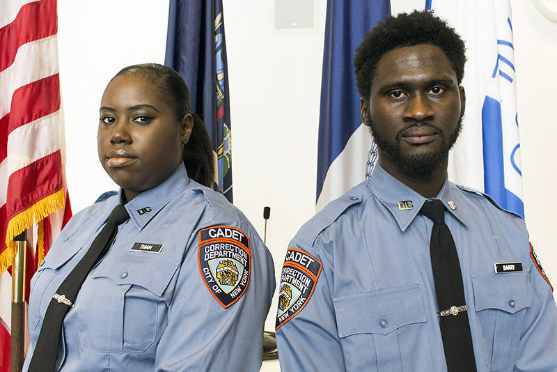 THE REAL WORLD: Prospective Correction Officers Fama Thiam (left) and Boubacar Barry were among the graduates of John Jay College of Criminal Justice’s CEEDS program honored May 2. The cadets trained at Rikers Island for two months, and both admitted to being nervous when they first stepped into the jail. ‘Going from school straight to Rikers, sometimes you feel like “I’m really here? I’m around people who committed crimes.” But you don’t know people’s stories,’ Mr. Barry said.