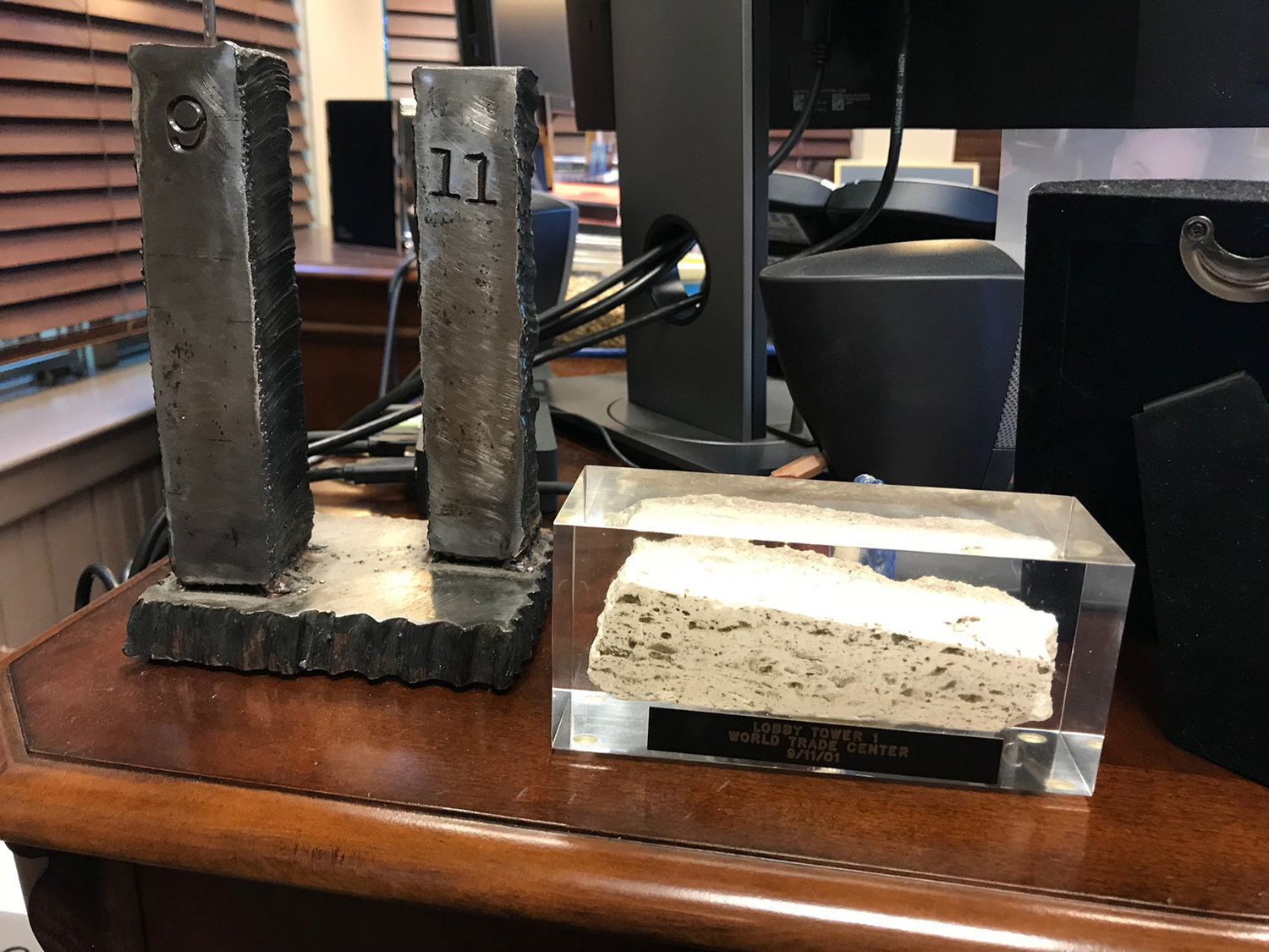 REMINDERS OF THE TRAGEDY: On Paul Nunziato’s desk sit a model of the towers sculpted from steel recovered from the wreckage of the World Trade Center and a plastic box containing a section of the marble floor from the lobby of Tower 1. The president of the PAPD union hardly needs the reminders; 17 years later, he is still dealing with the fallout from ‘the single worst day in the history of law enforcement in the United States.’
