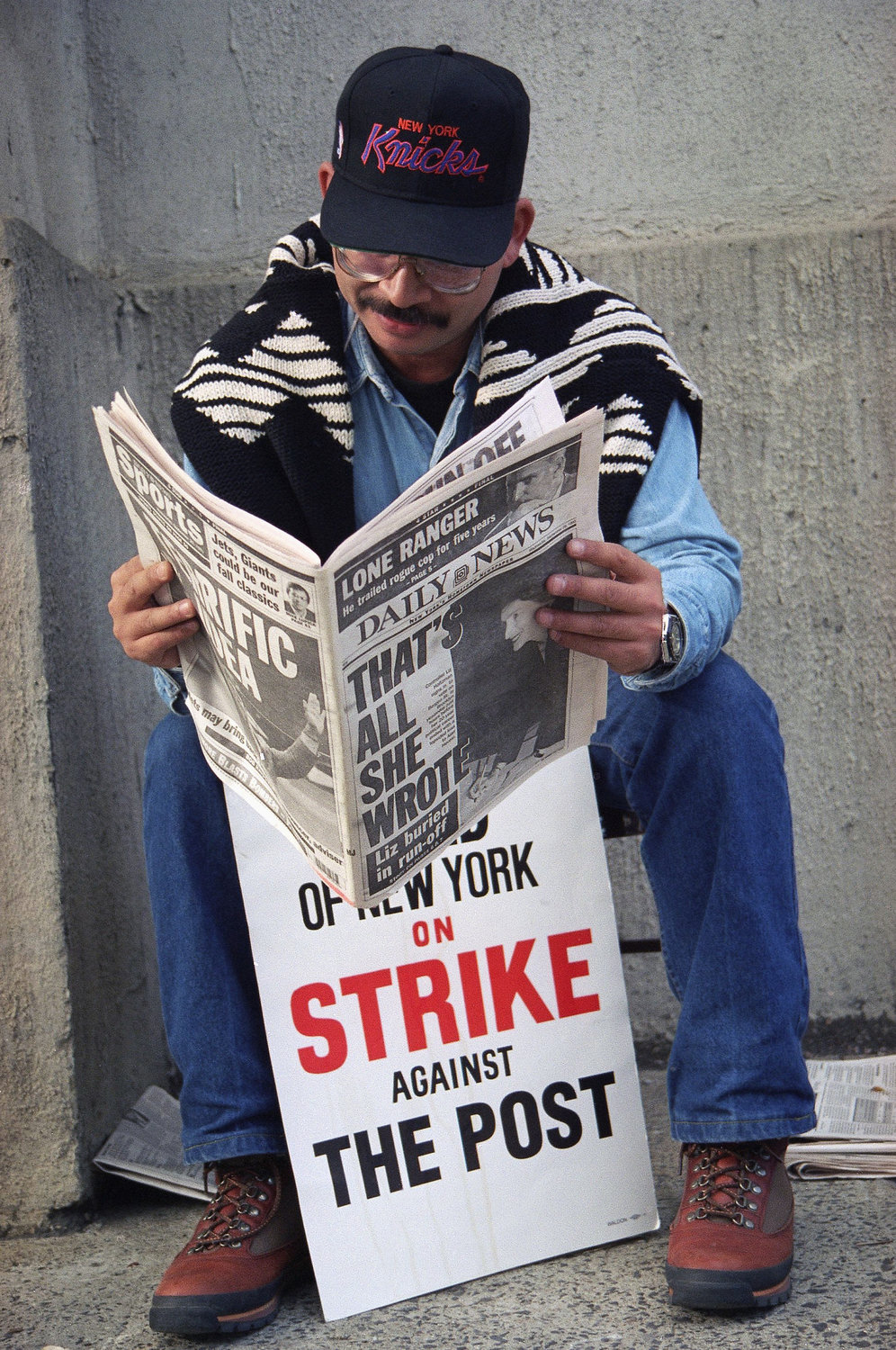 A striking New York Post employee takes a look at how the competition was covering the four-day walkout in September 1993, which concluded with a couple of hundred employees, including a future Chief editor, not being invited back to work.