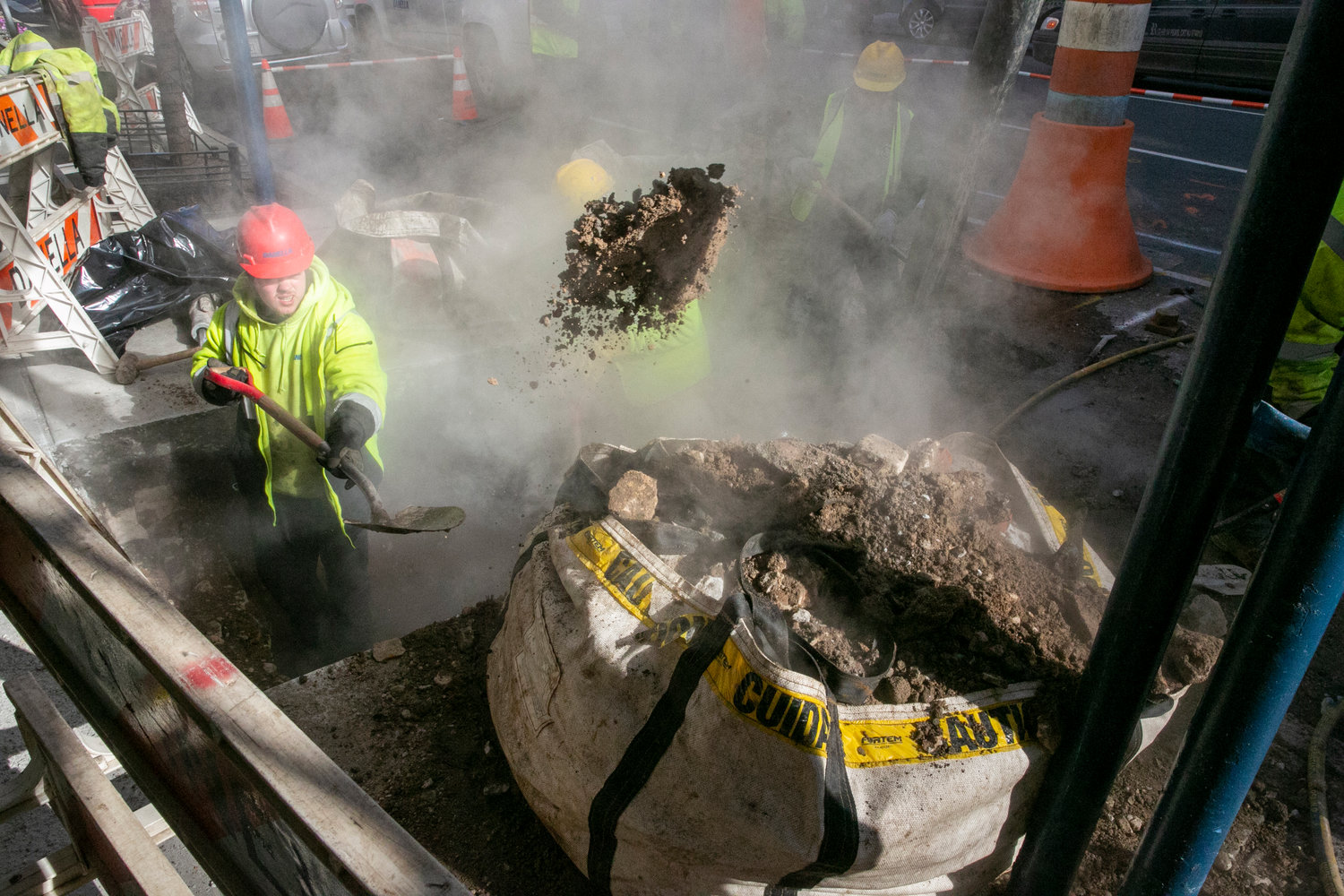 A worker shoveled dirt from under the street pavement while repairing a steam pipe in Manhattan in January. State lawmakers last week passed Carlos’ Law, which would raise the minimum fines for companies found criminally liable in the death or injury of a construction worker to $500,000. The bill is named for 22-year-old Carlos Moncayo, who was killed in a construction accident in 2015.