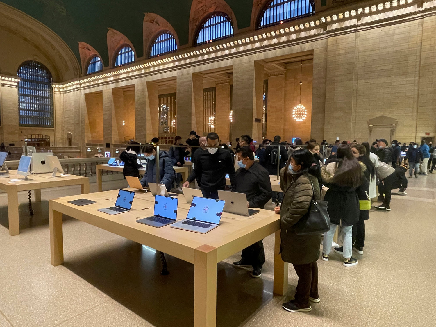 Employees and customers at Apple's Grand Central Terminal retail store last fall. Apple retail workers at the flagship store are said to be in talks to unionize, looking to establish higher wages and job benefits.