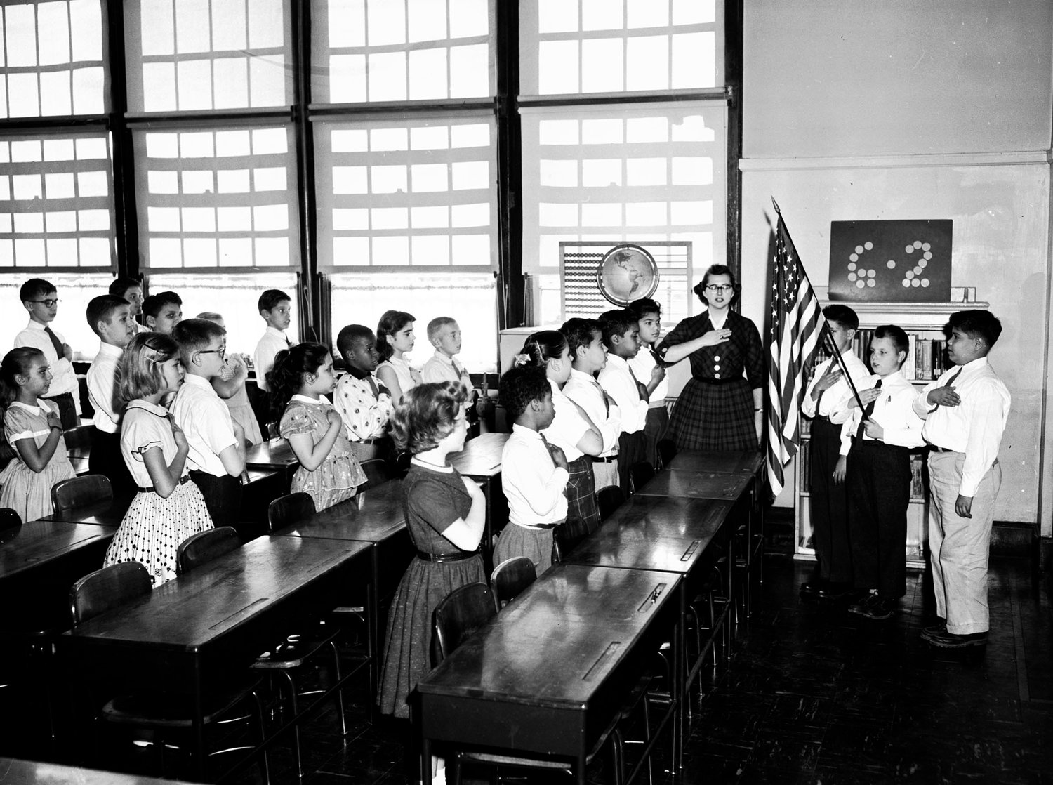 Students in Miss O'Harra's sixth-grade class at P.S. 116 in Manhattan's Kips Bay neighborhood recite the Pledge of Allegiance on Oct. 11, 1957.