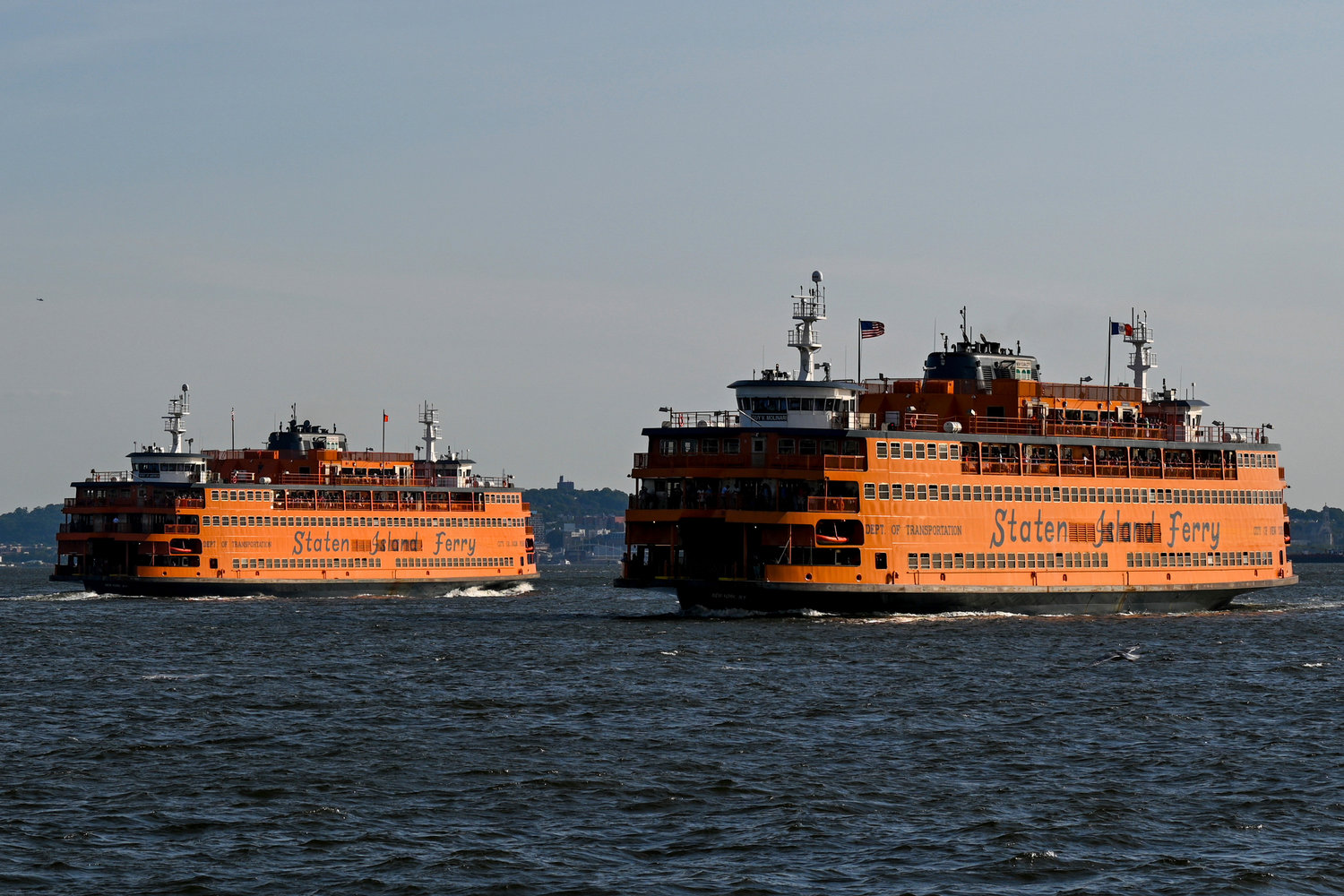 Staten Island Ferries sailed in New York Harbor in June. Ferry crews, many of them specially trained, have been without a contract for nearly 12 years. Several ferry crews failed to come to work two days earlier this week, stalling boats and thousands of commuters.