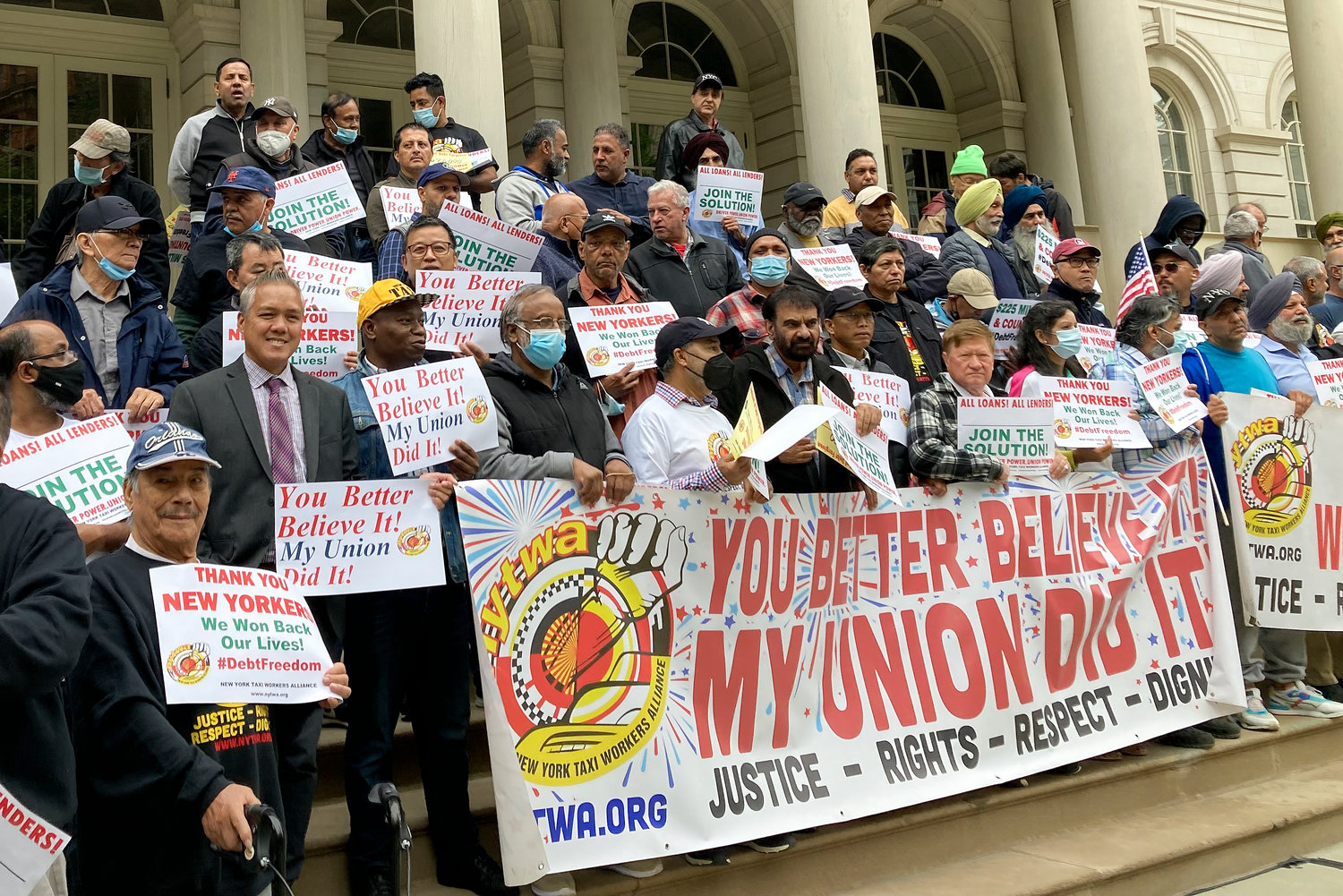 Taxi drivers rally outside City Hall on Friday, Sept. 30, 2022, in New York. City officials announced that struggling drivers have gotten $225 million in debt relief over the last two weeks, but thousands more loans have yet to be refinanced after a cabbie debt crisis, and officials extended the relief program deadline.