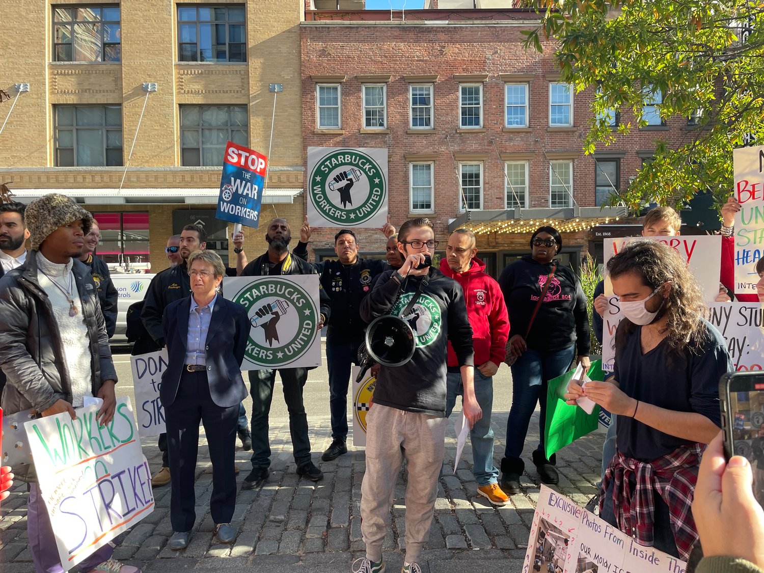 Starbucks workers and their union allies rallied outside the Reserve Roastery on West 15th Street last month. A reinspection report following a visit from state health officials Dec. 15th found that Starbucks 'sells potentially hazardous foods' but found no evidence of mold, even though workers said they showed inspectors photos of moldy ice.