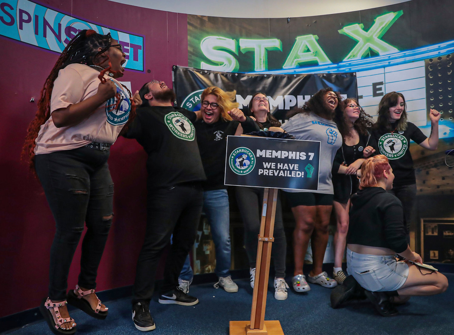 A group of fired Starbucks employees celebrate the result of a vote to unionize one of the coffee company's locations in Memphis, Tennessee, last June. Starbucks said they were fired for violating company policies, but the seven say they were let go in retaliation for unionization efforts.