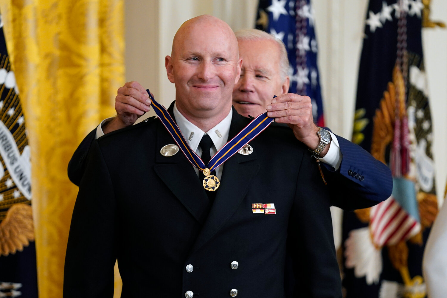 President Joe Biden presenting the Medal of Valor, the nation's highest honor for bravery by a public safety officer, to FDNY Lt. Justin Hespeler Wednesday in the East Room of the White House.
