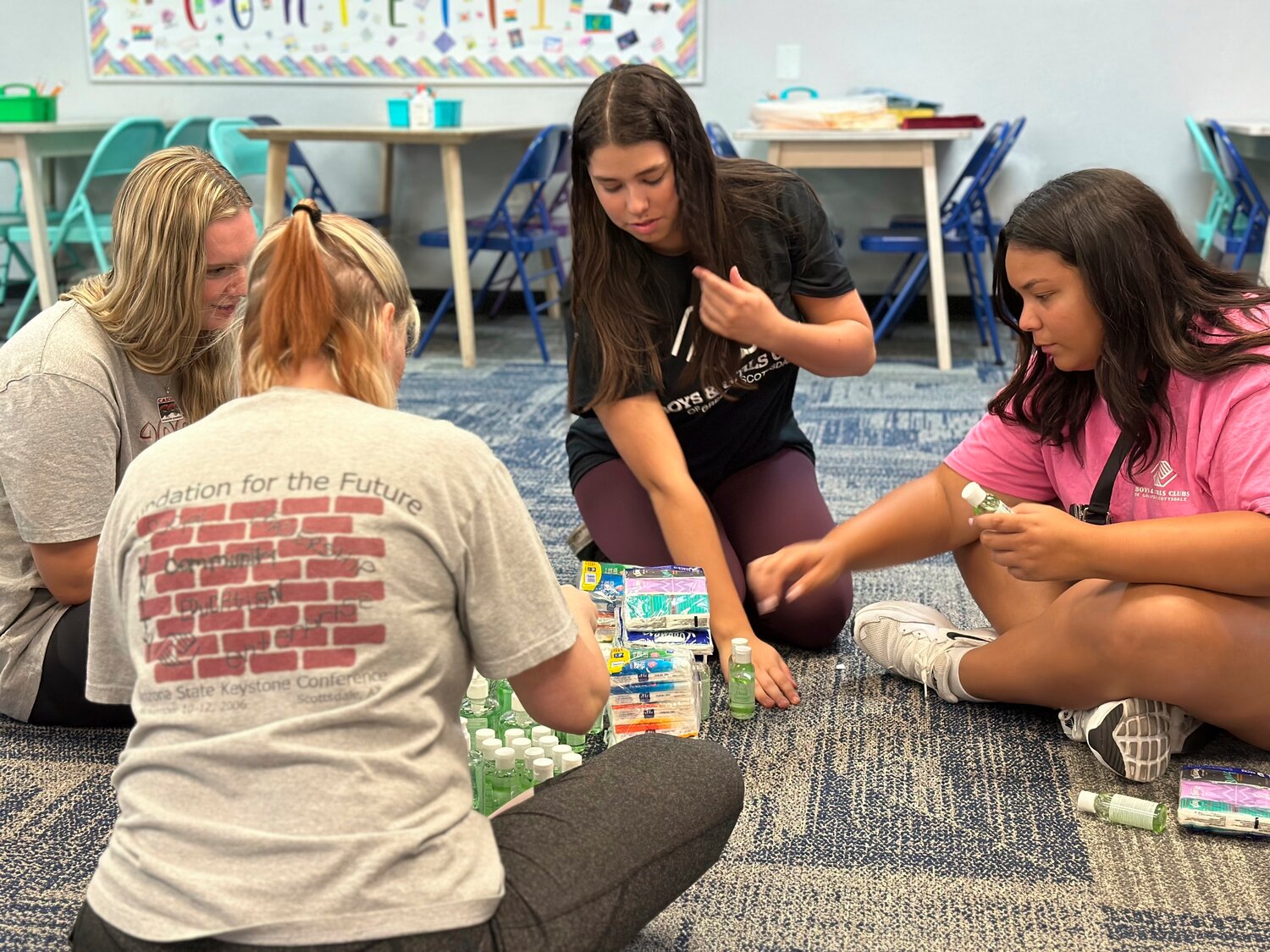 Addison Beer, 17, second from right, and Jaylin Wilson, 18, right, prepared for summer campers arriving next week at the Virginia G. Piper branch of the Boys & Girls Club where she works, in Scottsdale, Ariz. With the job market the tightest in half a century, younger workers are playing a critical role in kicking off the summer tourism season.