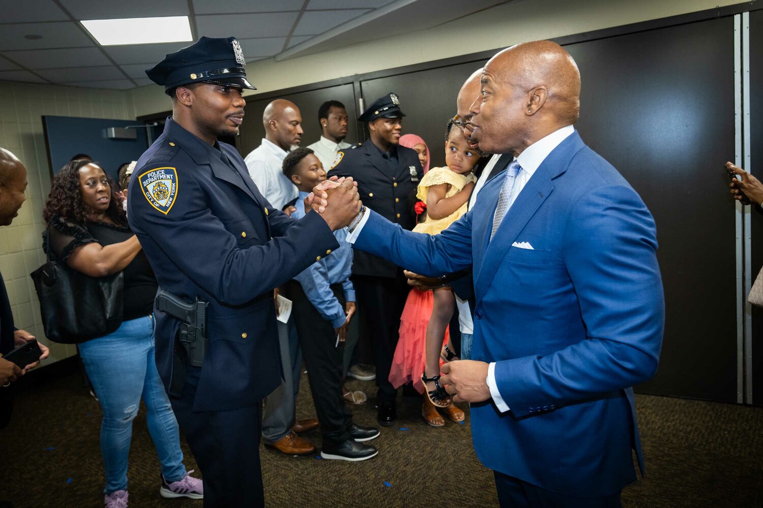 Mayor Eric Adams with a newly minted NYPD officer following a Police Academy graduation July 1, 2022, at Madison Square Garden.
