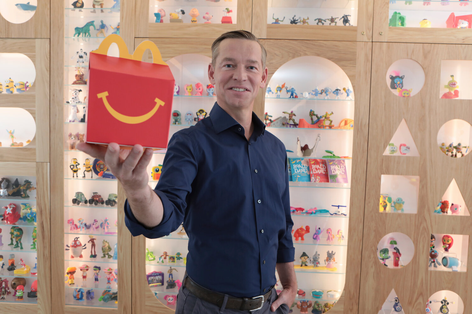 McDonald's CEO Chris Kempczinski, pictured with a Happy Meal at the company’s Chicago headquarters, made 2,251 times more than the average-salaried worker at the Golden Arches last year.
