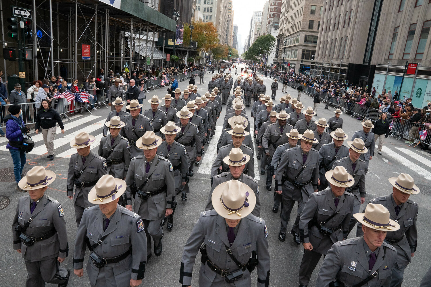 State Police Troopers marched up Fifth Avenue along the Veterans Day Parade route in 2021. Governor Kathy Hochul on Friday signed into law legislation benefiting veterans, including a bill that provides them with internship opportunities in the state Senate and Assembly and another that expands their eligibility for civil-service positions.