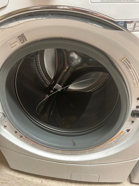 A washing machine at Azalea Manor with dirty water inside. Residents in September it had been like that since February.