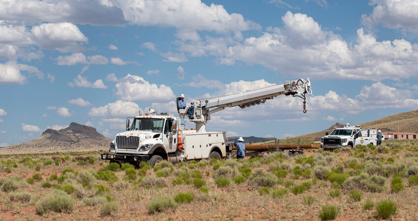 Electrical lineworkers survey the terrain they'll break through to set up power lines on the Navajo Nation. Ten employees from PWC participated in Light Up Navajo this June; the project bills itself as “mutual aid without a storm.”
